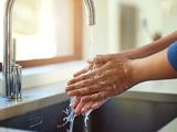 Hands under running water