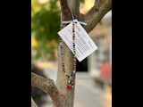 Handmade bracelet hanging on tree