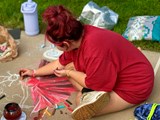 Artist drawing with Chalk