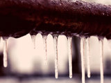 Ice hanging off a frozen pipe